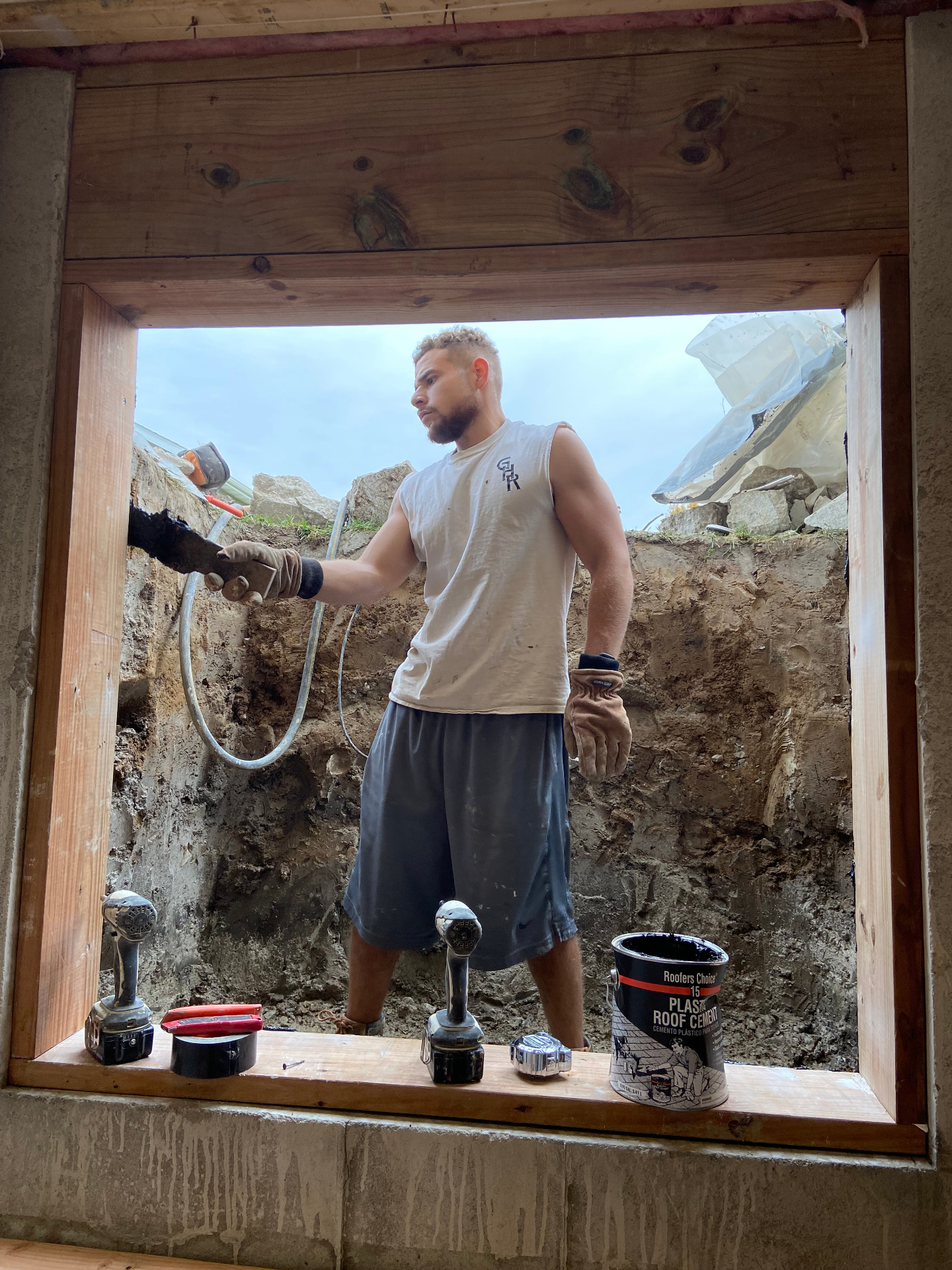GHR Egress Windows GM Justin preparing to install a 4x4 slider egress window in Glen Carbon, IL with framed opening and treated wood buck